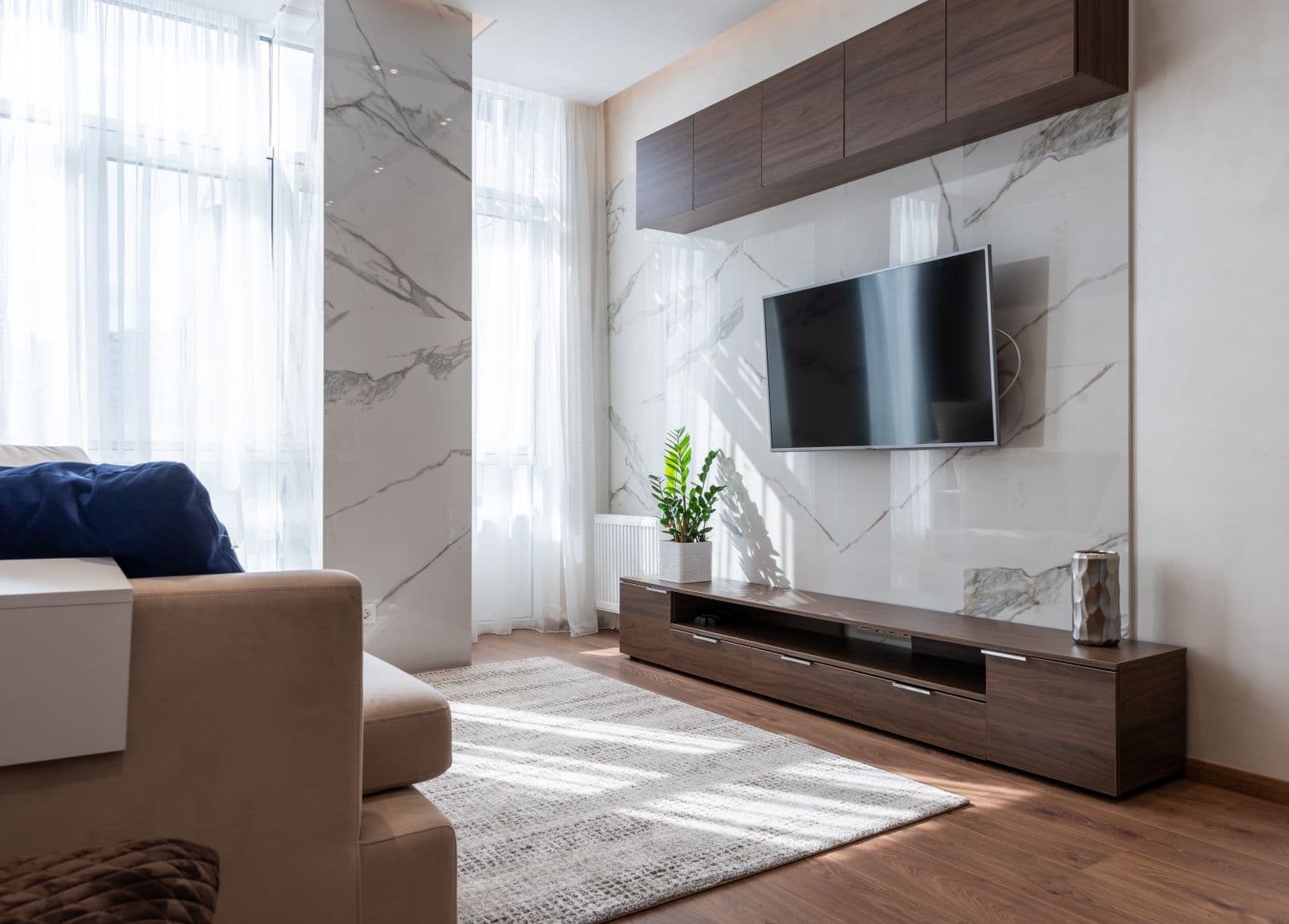 A living room with a mounted television, the kind of install we do in West University Place